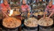 Man dips hand in hot oil to fry chicken; video will leave you stunned