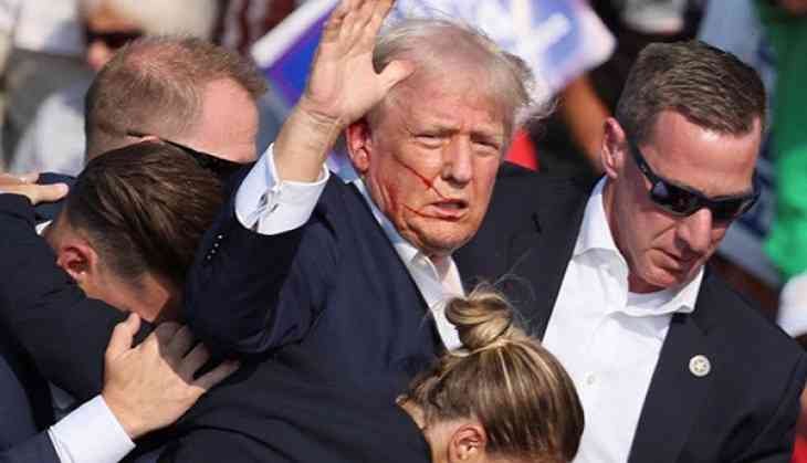 Former US President Donald Trump being escorted by US Secret Service agents